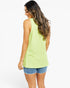 A woman shown from the back wearing a sleeveless lime green ribbed top and denim shorts against a plain white background.