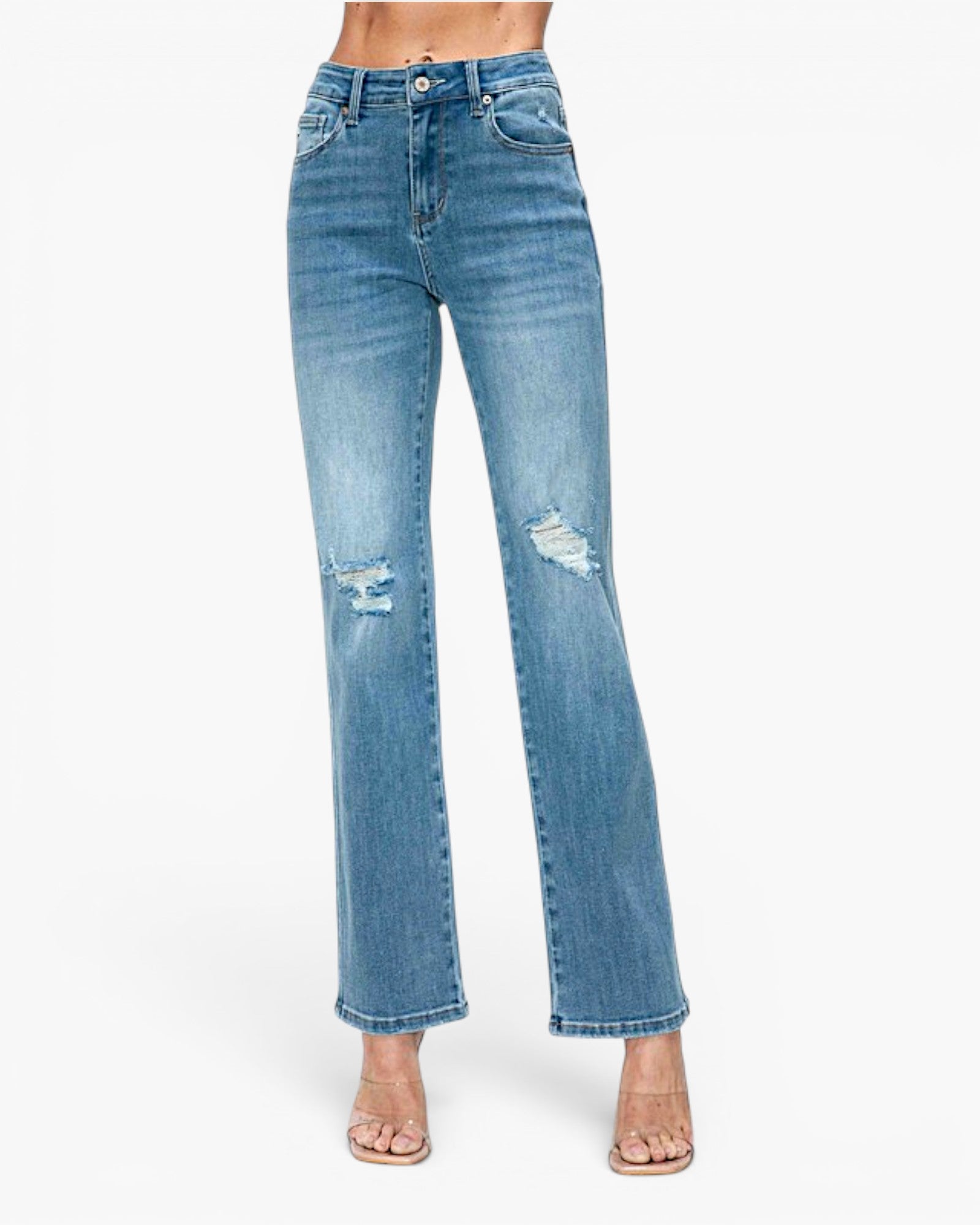 Light blue high-waisted straight-leg jeans with distressed rips on the thighs and knees, shown on a model wearing clear high-heeled sandals against a white studio background.