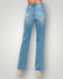 Light blue jeans worn by a person on a plain background