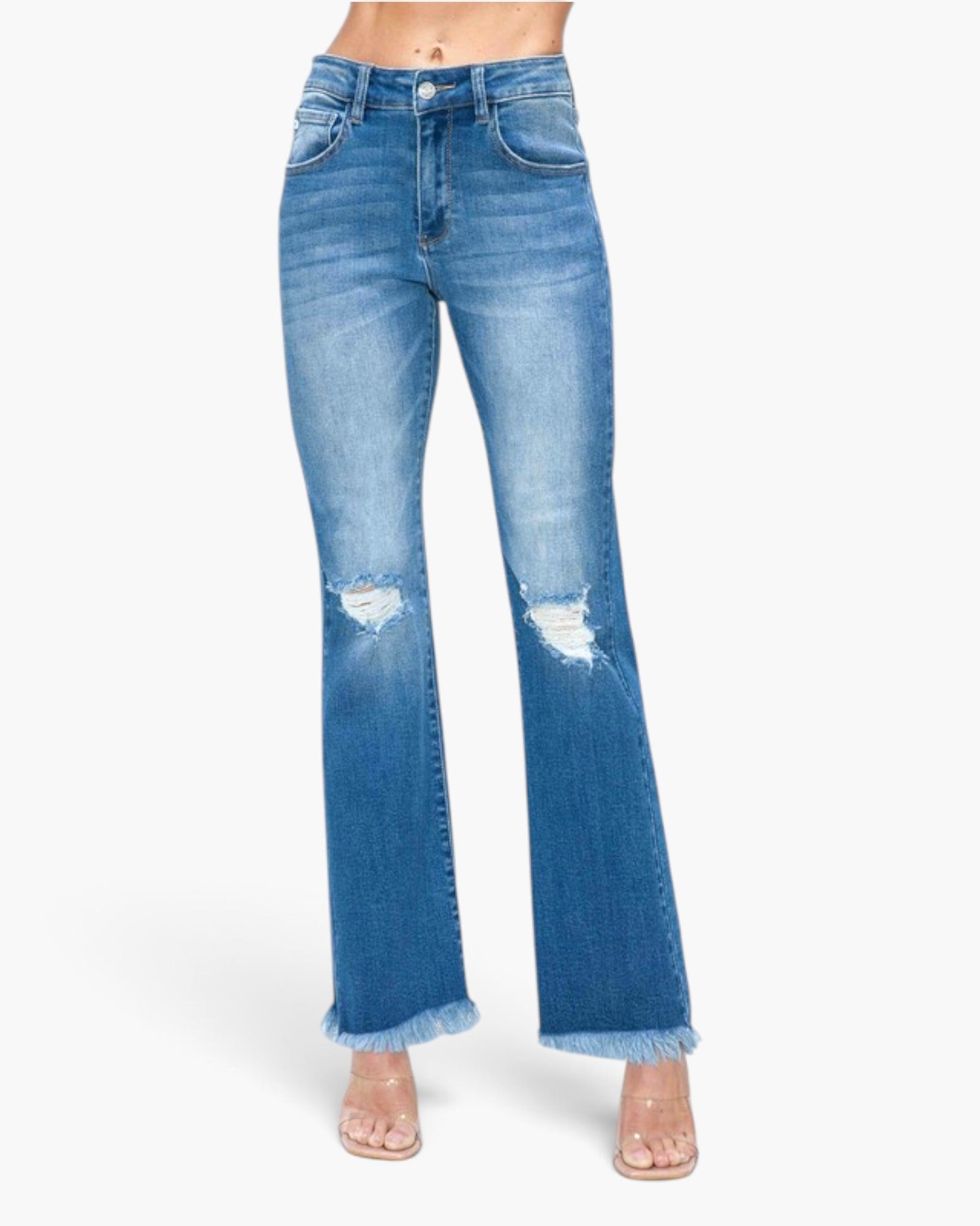 A pair of high-waisted, light blue denim flare jeans with distressed rips on the thighs and frayed hems, shown on a model against a plain white background.