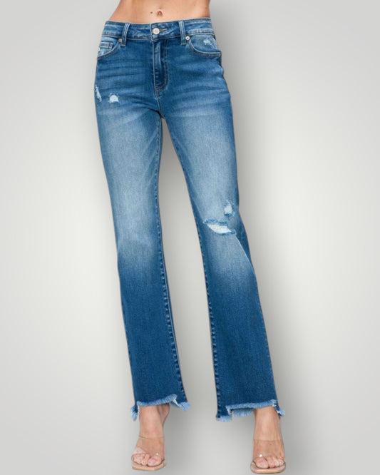Blue jeans with a slight distressed look on a gray background