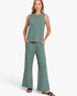 Beach Rose Co. sage green textured sleeveless crew-neck top and wide-leg pants set with side pockets on a model