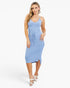 A woman modeling a light blue sleeveless midi dress with spaghetti straps, a V-neckline, a drawstring waist, and a side slit, paired with white heeled sandals against a plain white studio background.