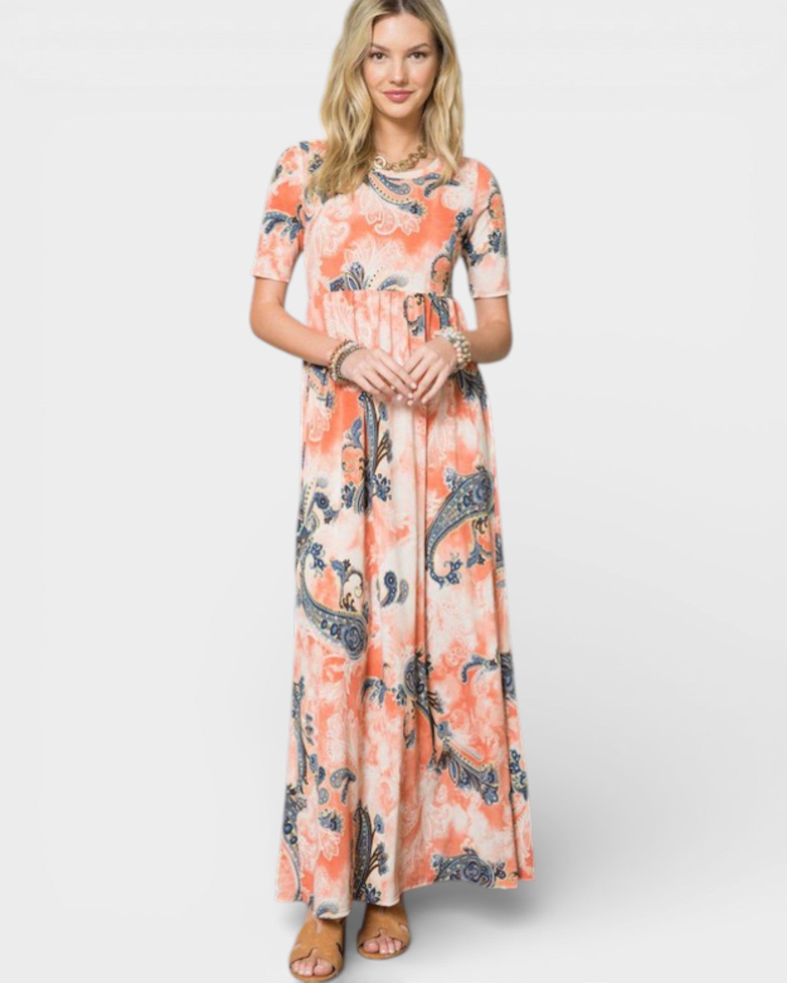 Woman wearing a floral dress on a white background