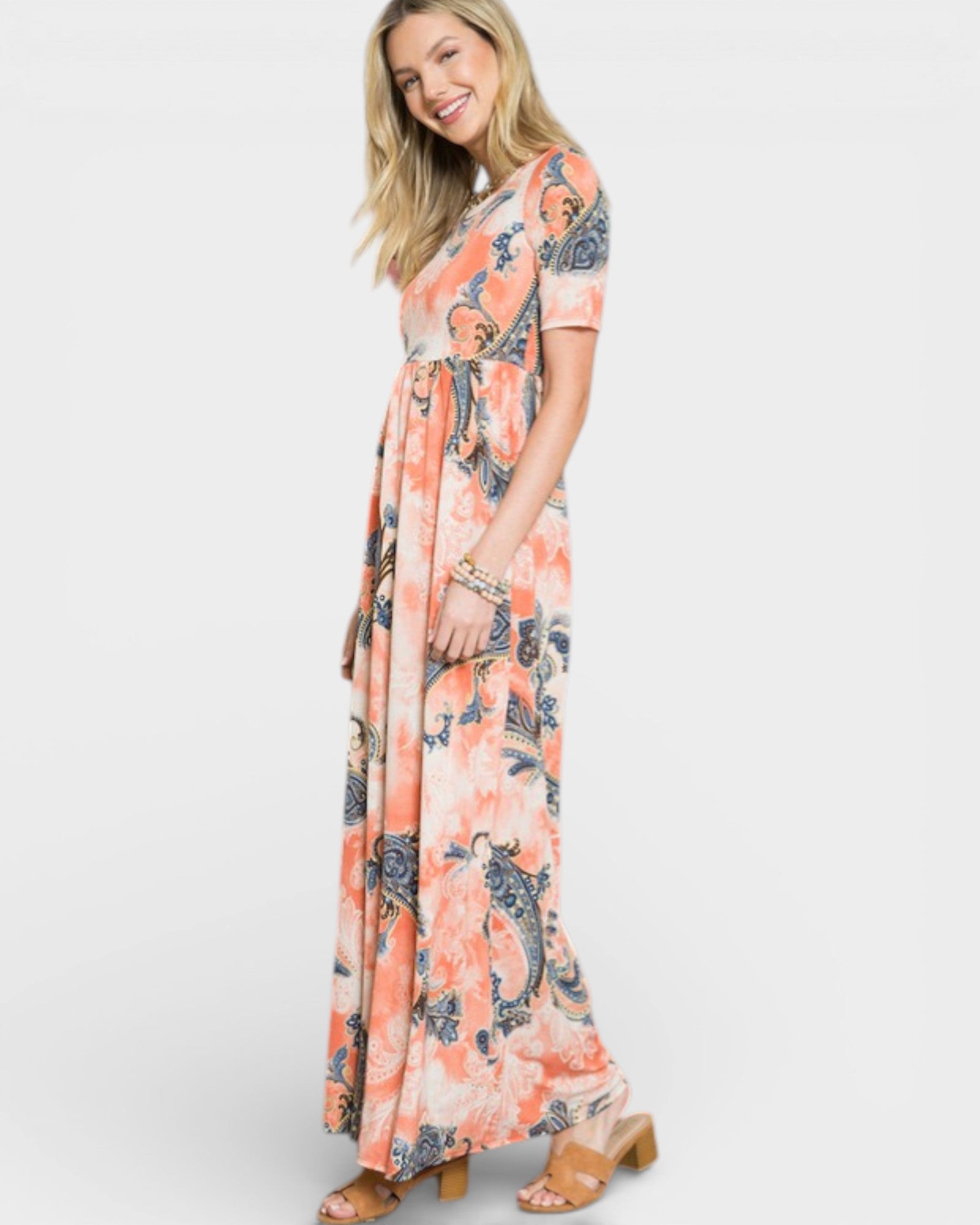 Woman wearing a floral dress on a white background