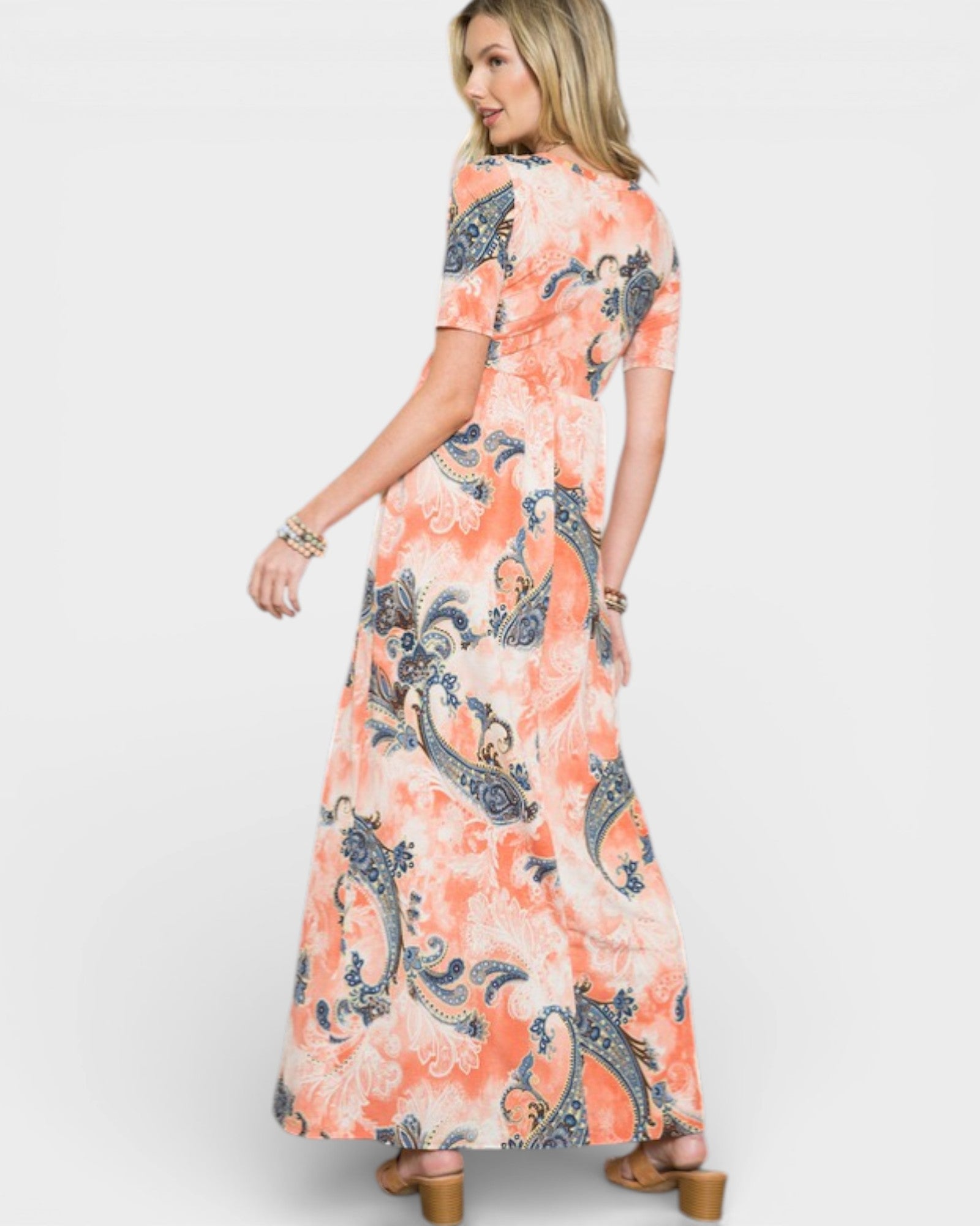 Woman wearing a floral dress with a white background