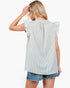 A woman shown from the back wearing a light green and white gingham ruffle-sleeve top and denim shorts against a plain white background.