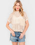 Blusa de crochet transparente con cuello alto en color avena