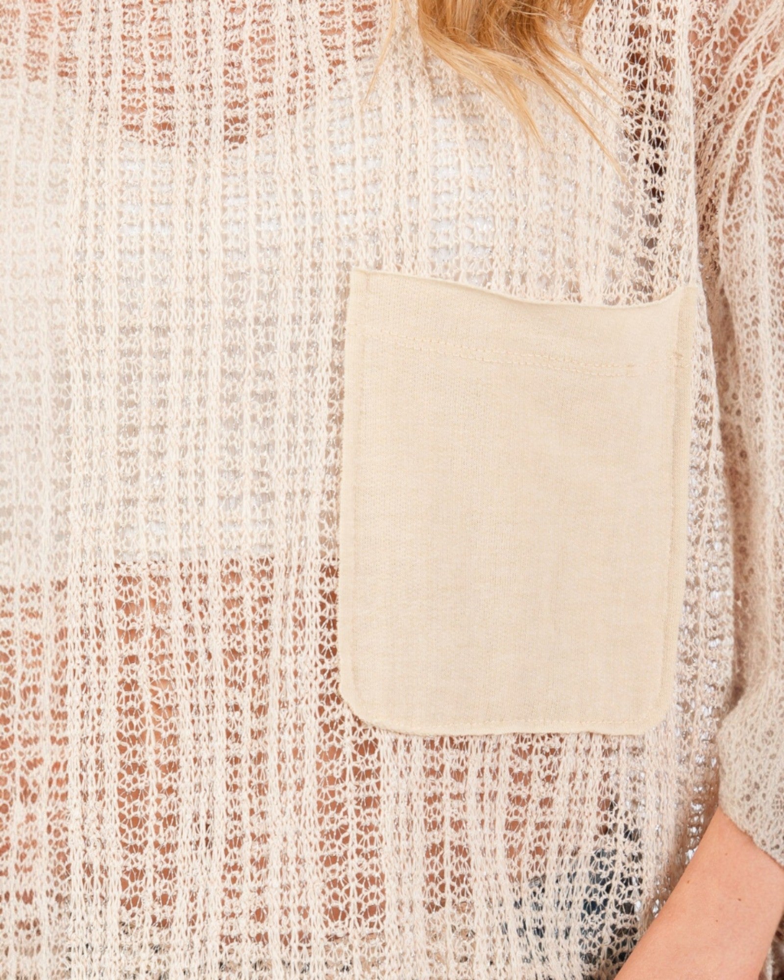 Close-up of a textured sweater with a pocket