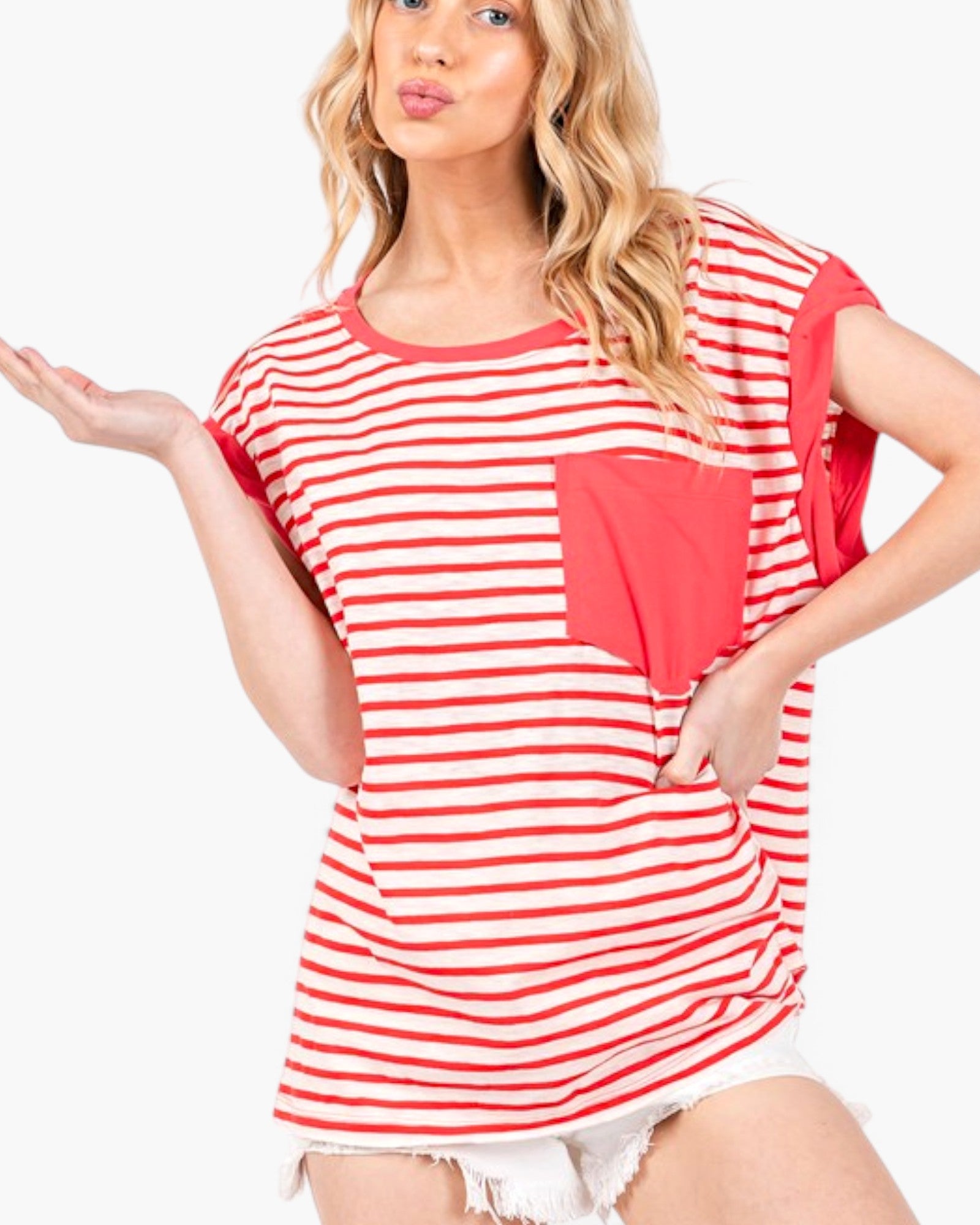 A woman modeling a red and white striped short-sleeve t-shirt with a solid red chest pocket, set against a plain white background.