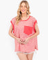 A woman modeling a red and white striped short-sleeve top with a solid red chest pocket, set against a plain light gray background.