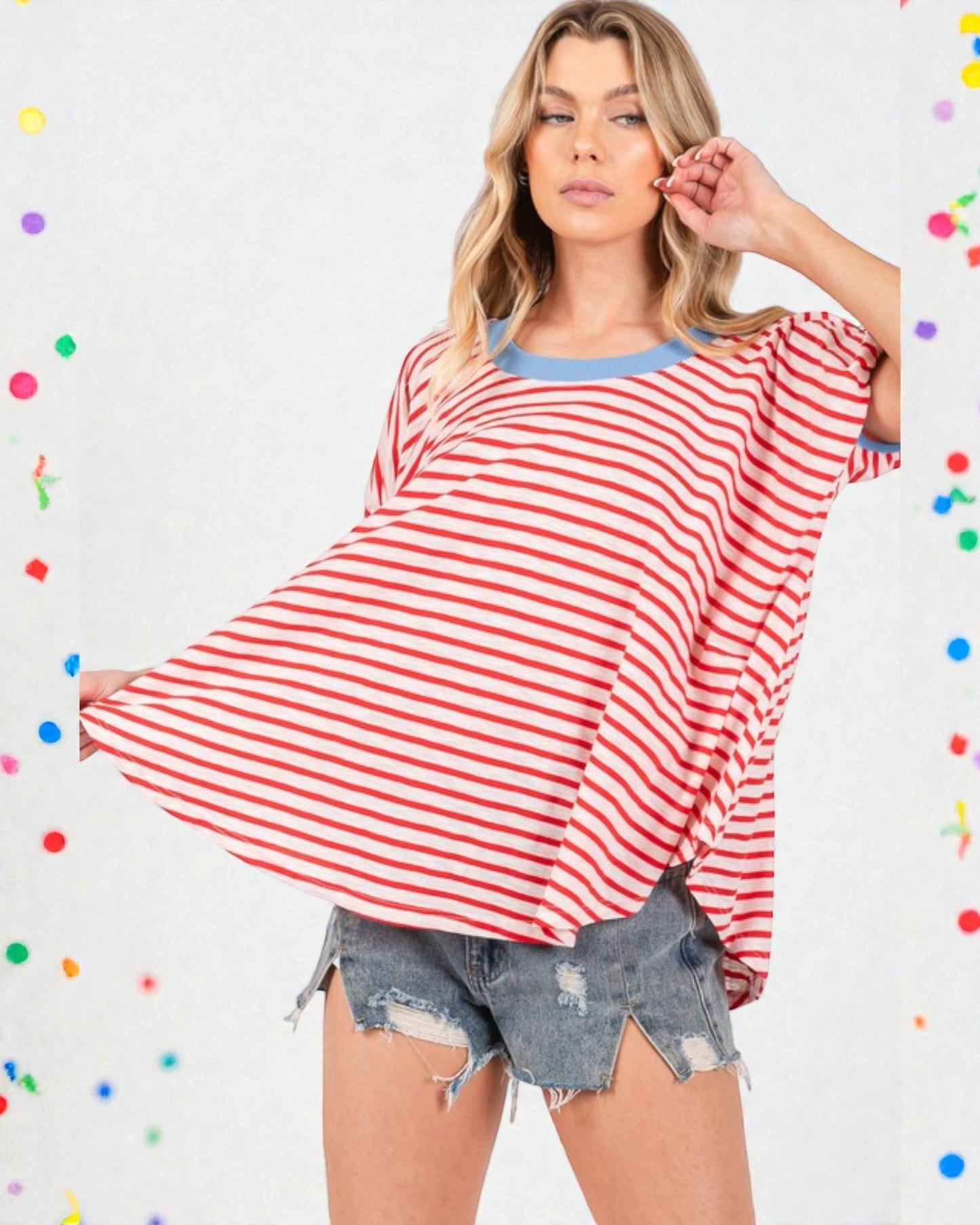 Woman wearing a red and white striped shirt with a colorful polka dot background