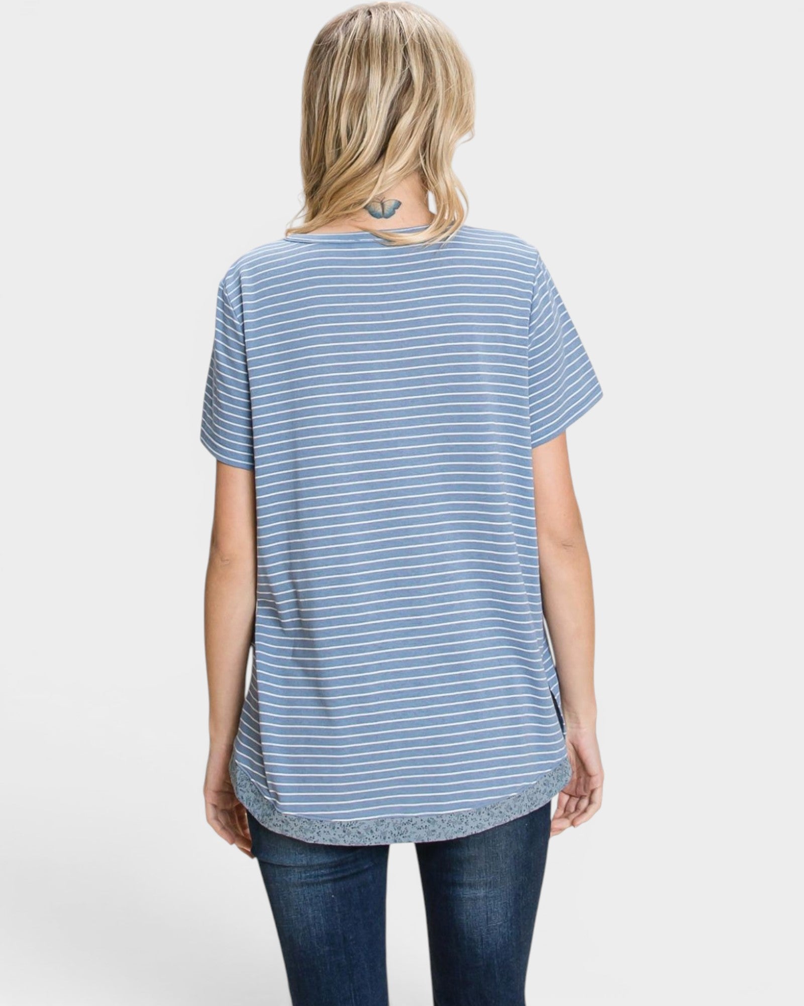 Woman wearing a blue and white striped t-shirt on a white background