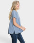 Woman wearing a blue striped shirt and jeans on a white background