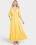 Woman wearing a yellow dress on a white background