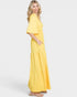 Woman wearing a yellow dress on a white background