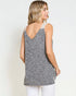 Woman wearing a gray sleeveless top with a white background