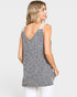 Woman wearing a gray sleeveless top with white trim on a light gray background