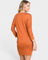Woman wearing a rust-colored dress on a white background