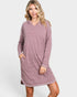 Woman wearing a mauve hooded dress on a white background