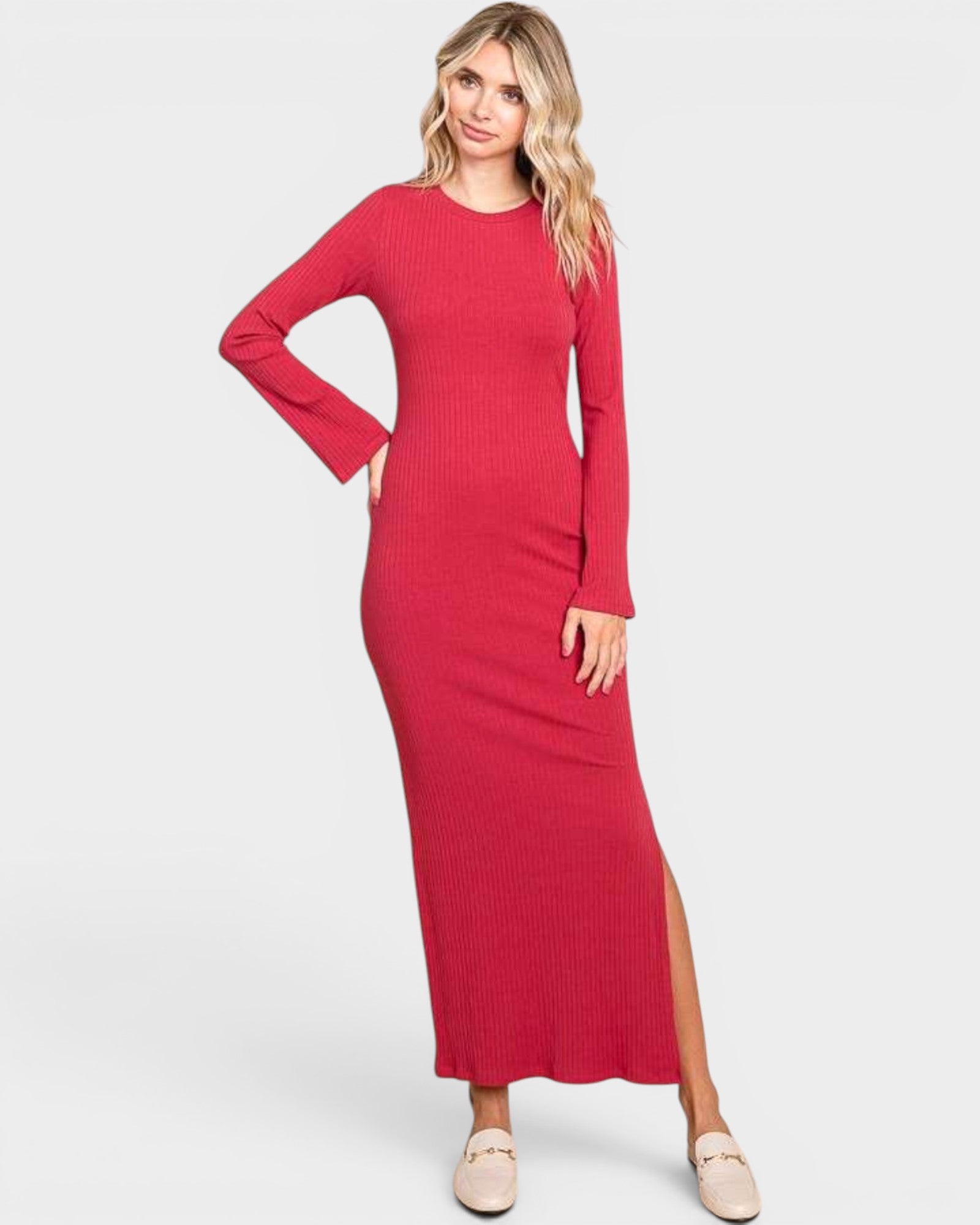 Woman wearing a red long-sleeve dress on a white background