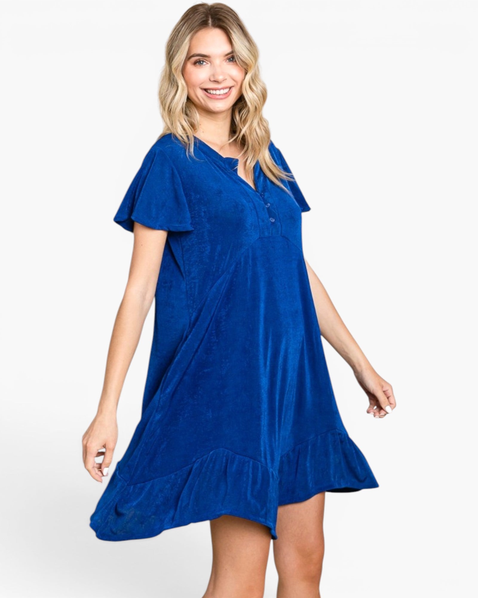 A woman modeling a short-sleeve blue velvet dress with a ruffled hem against a plain white background.