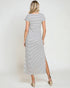 Woman wearing a striped dress with a white background