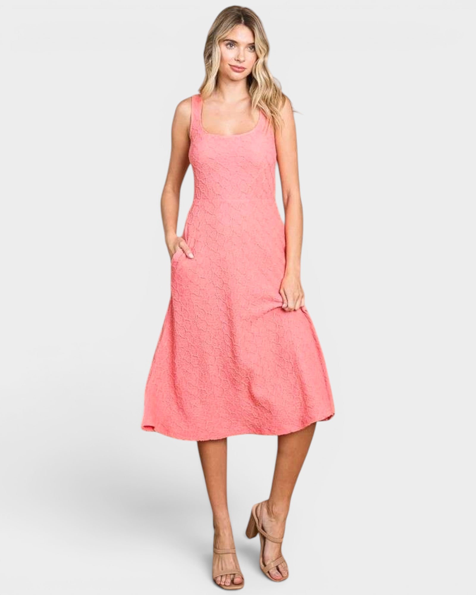 Woman wearing a pink dress on a white background