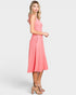 Woman wearing a pink dress on a white background
