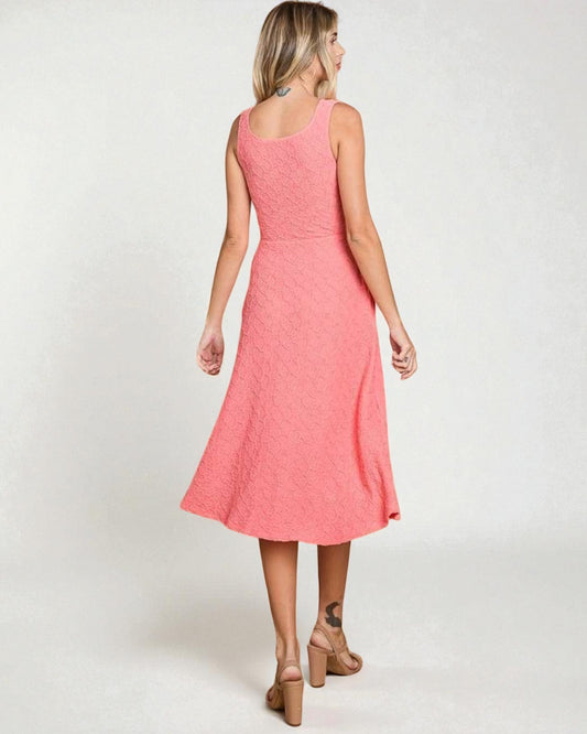 Woman wearing a pink dress on a white background