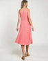 Woman wearing a pink dress on a white background
