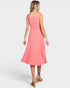 Woman wearing a pink dress on a white background