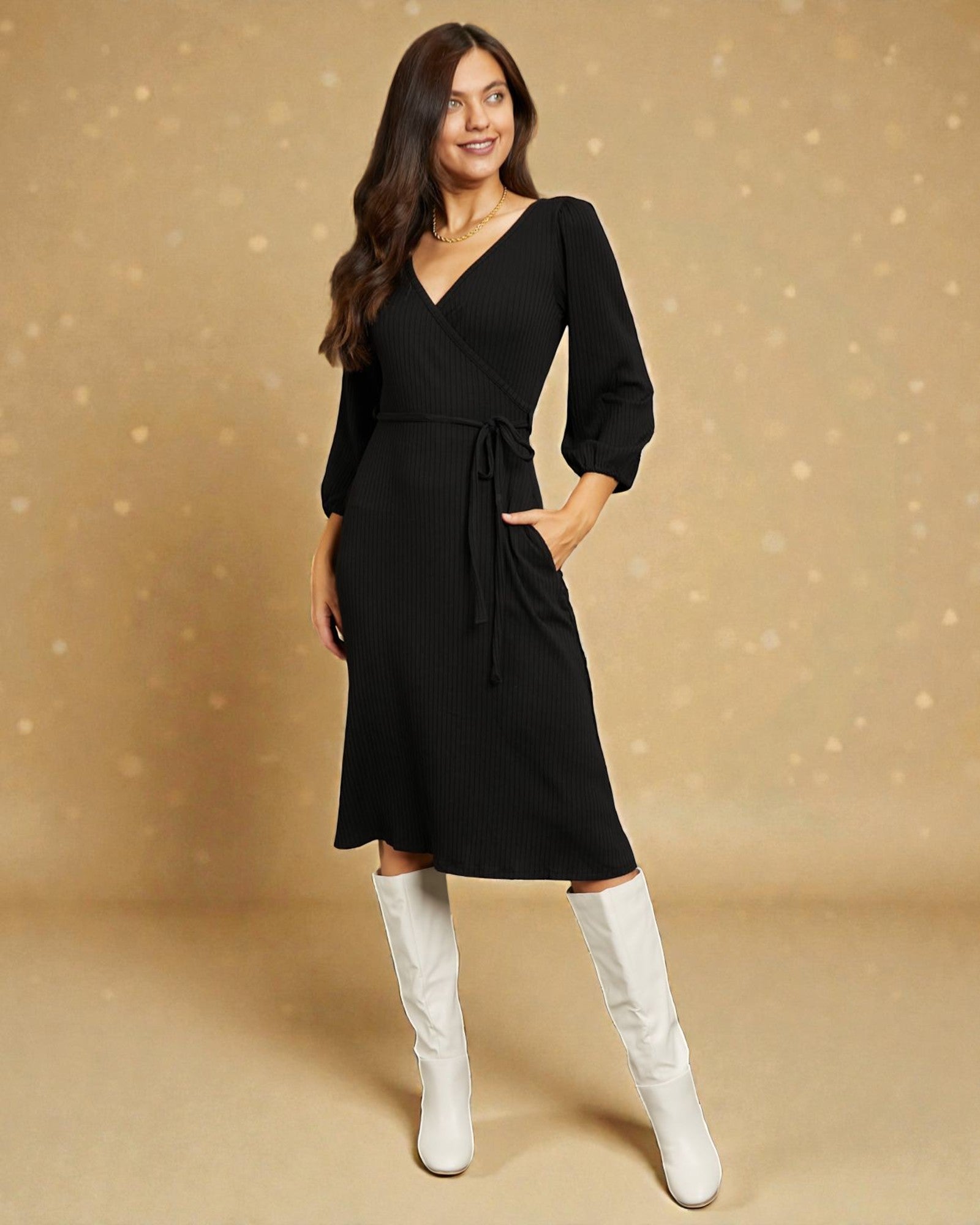 Woman wearing a black dress with white knee-high boots on a beige background