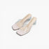 A pair of women's square-toe mule sandals with transparent mesh uppers, pale blush pink faux-leather toe caps, and clear textured block heels, shown on a light gray background.