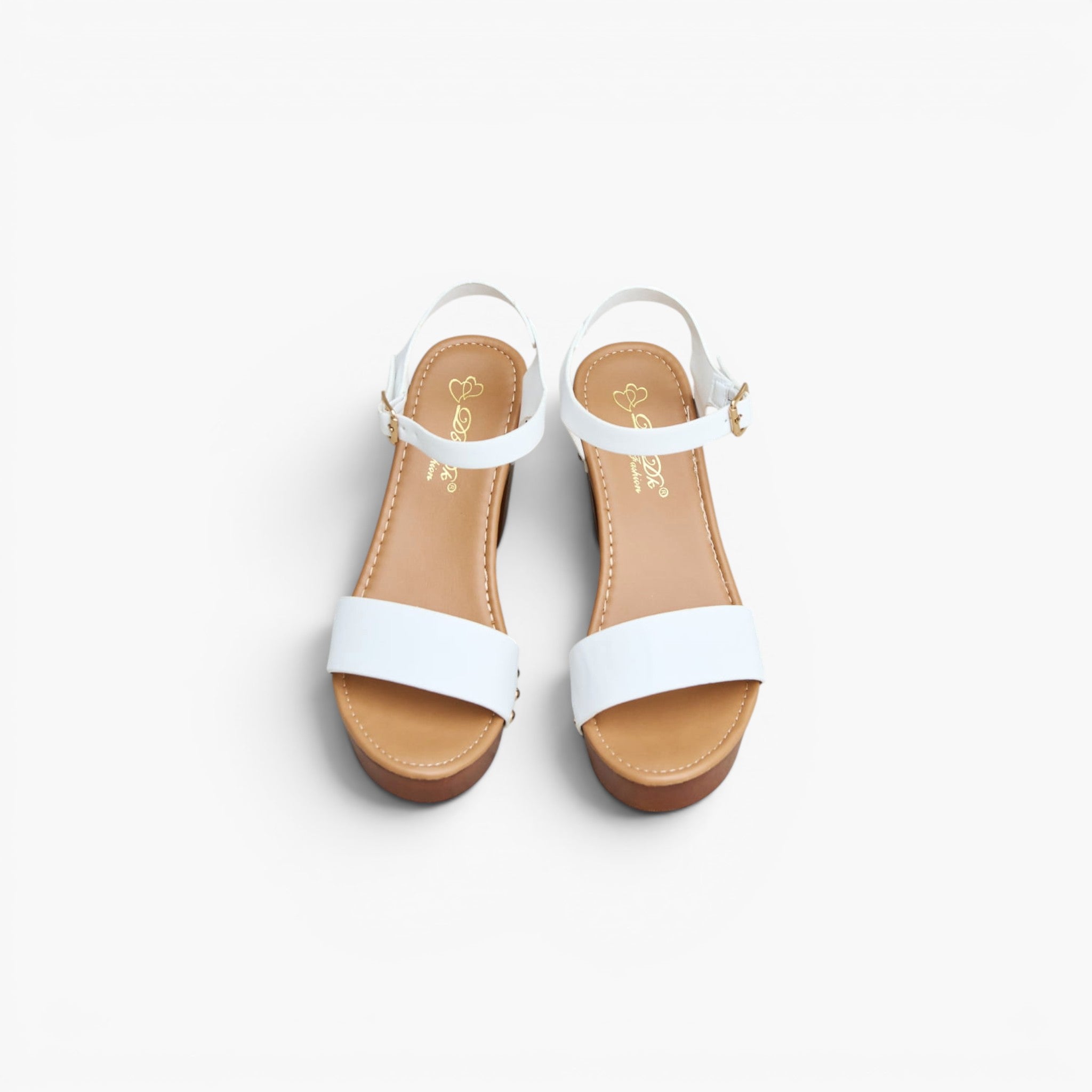 A pair of white leather slide sandals with low brown block heels and adjustable ankle straps, shown from a top-down view on a light gray background.