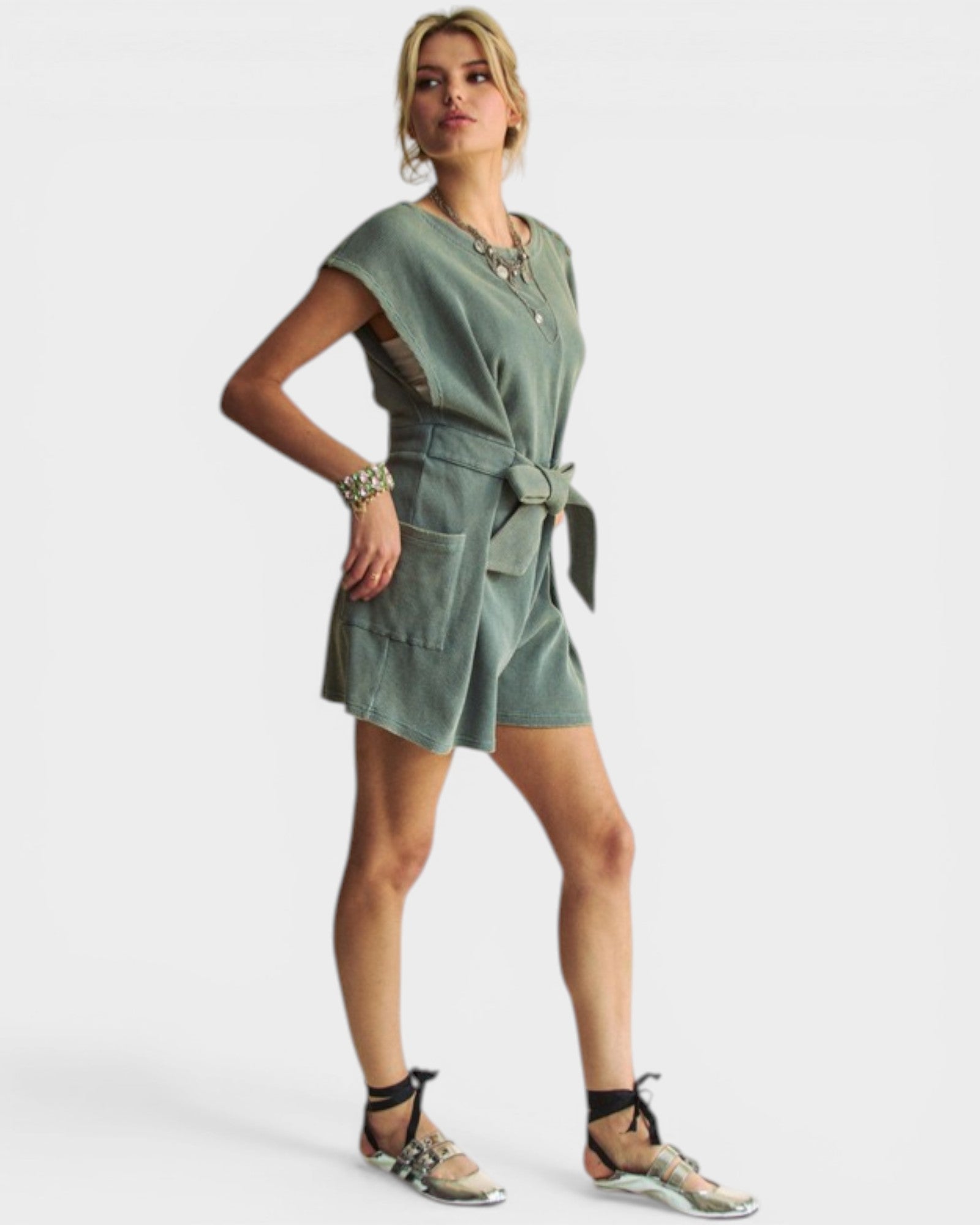 Woman wearing a green dress on a white background