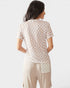 Woman wearing a checkered top with lace details on a white background