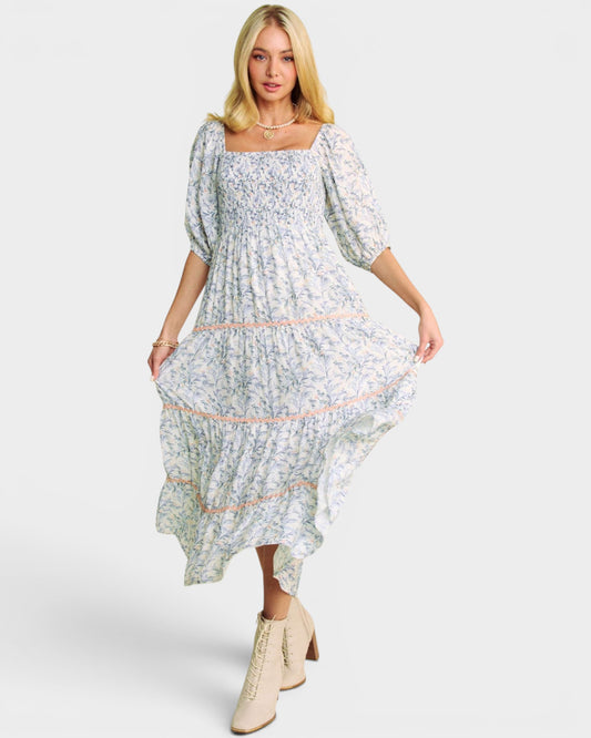 Woman wearing a floral dress on a white background