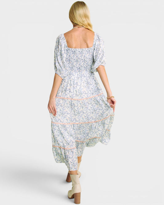 Woman wearing a floral dress on a white background