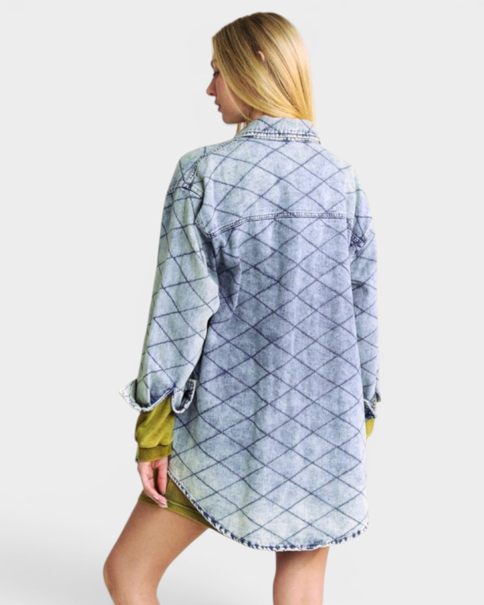 Woman wearing a blue diamond patterned shirt on a white background