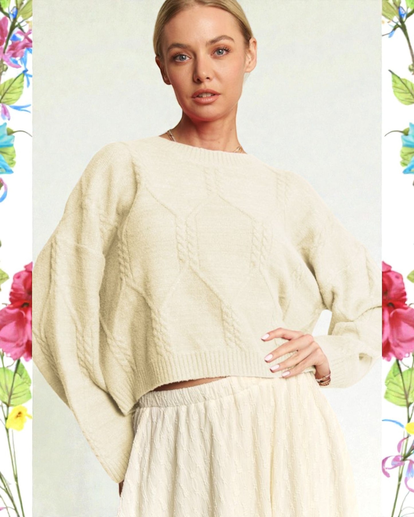 Woman wearing a cream sweater and skirt with floral border