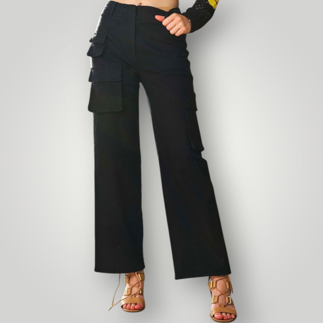 Black cargo pants worn by a person on a light gray background