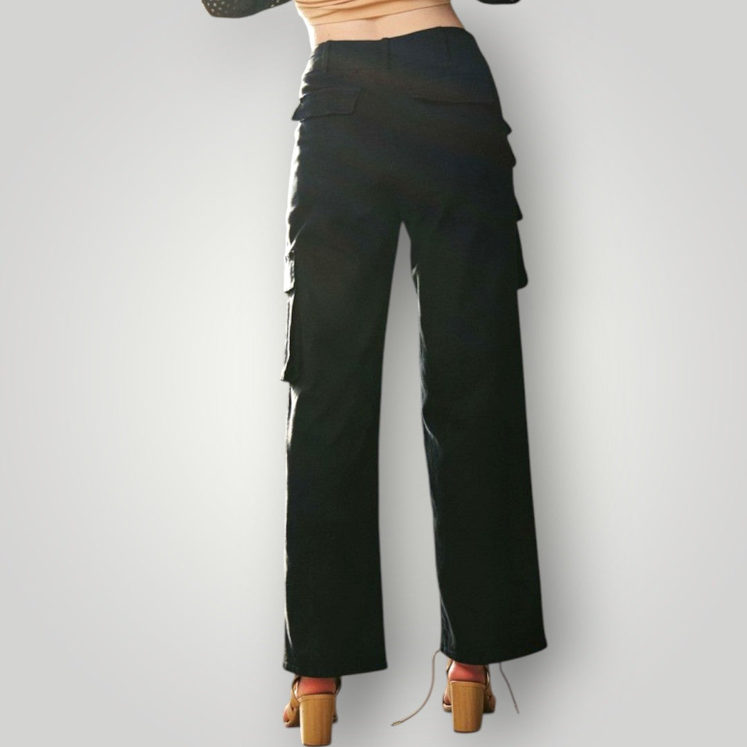 Black cargo pants worn by a person on a plain background