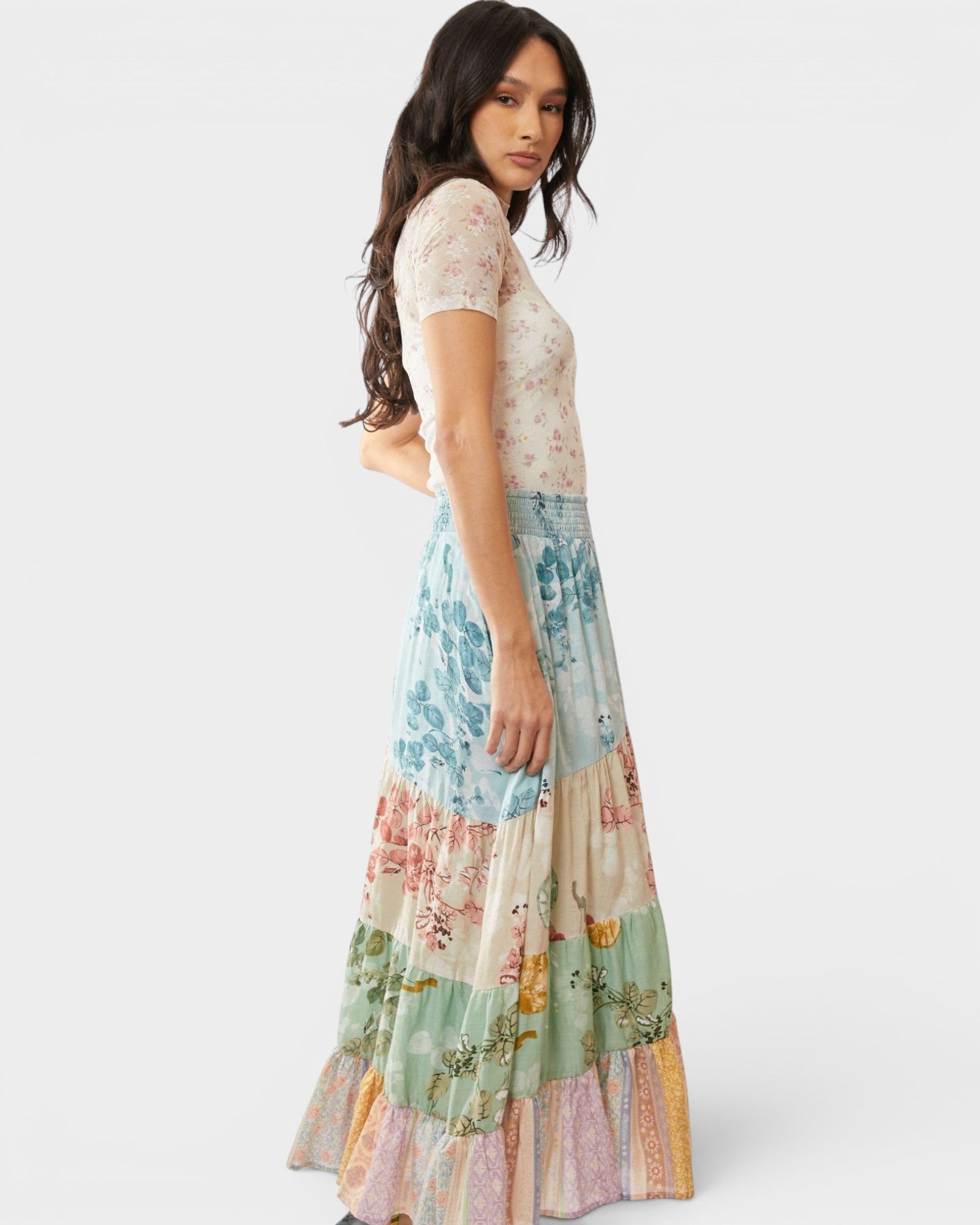 Woman wearing a floral dress with a white background