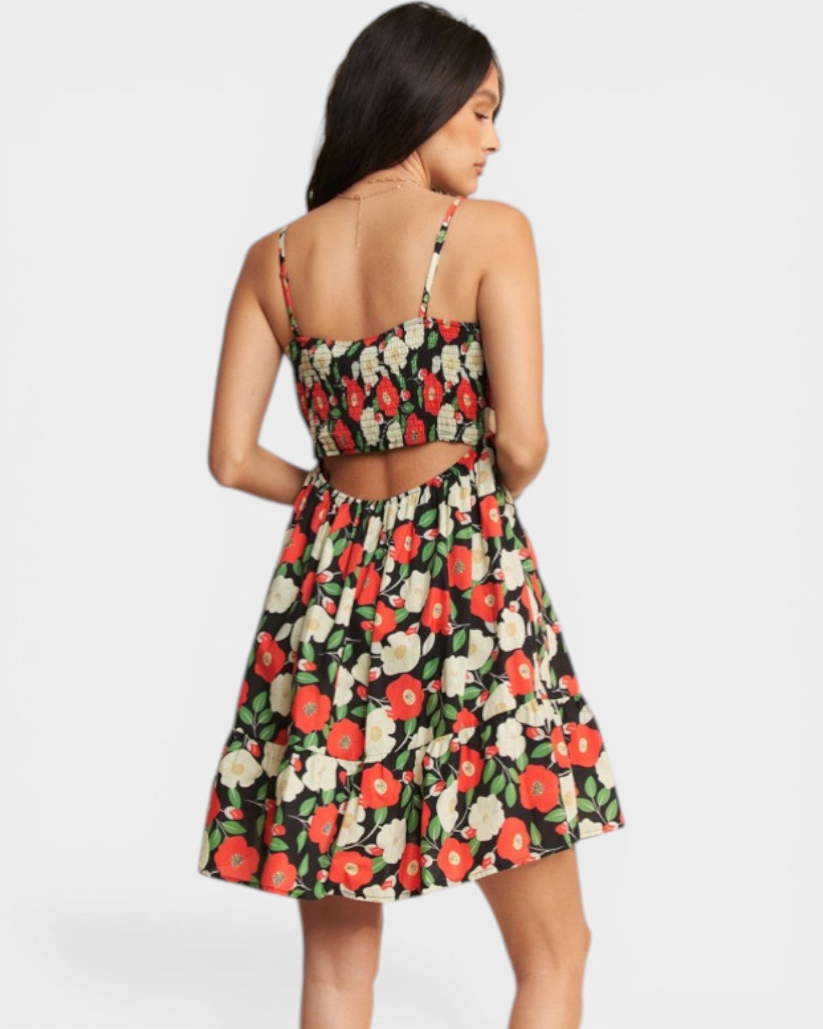 Woman wearing a floral dress with a white background