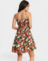 Woman wearing a floral dress with a white background