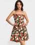 Woman wearing a floral dress on a white background