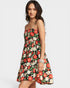 Woman wearing a floral dress on a white background