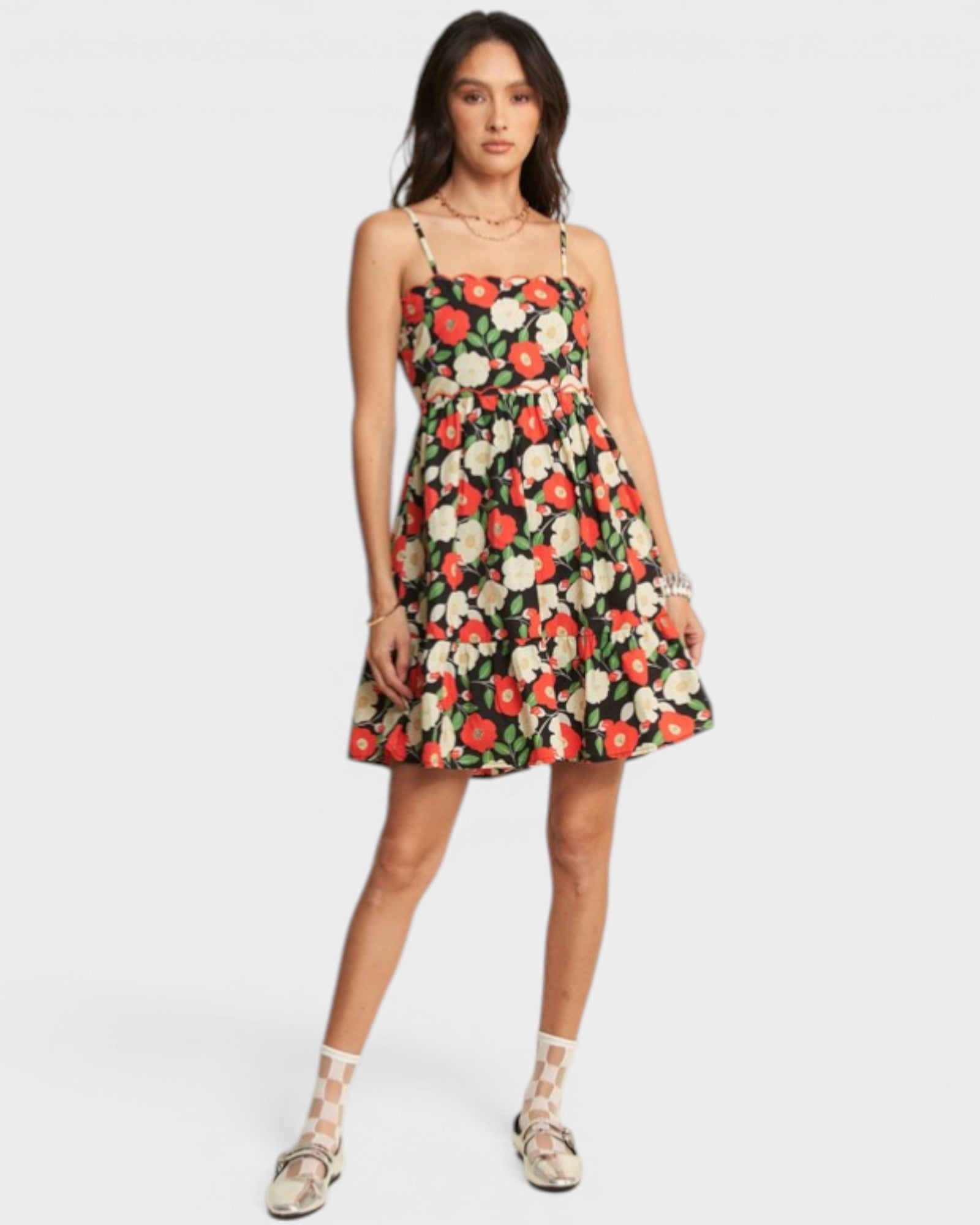 Woman wearing a floral dress on a white background