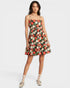 Woman wearing a floral dress on a white background